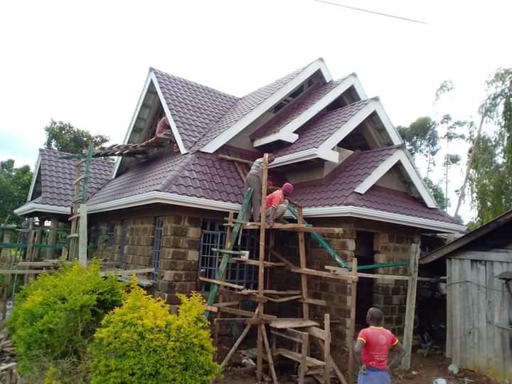 Stone-coated tile roof installation on residential house — Everbest Mabati